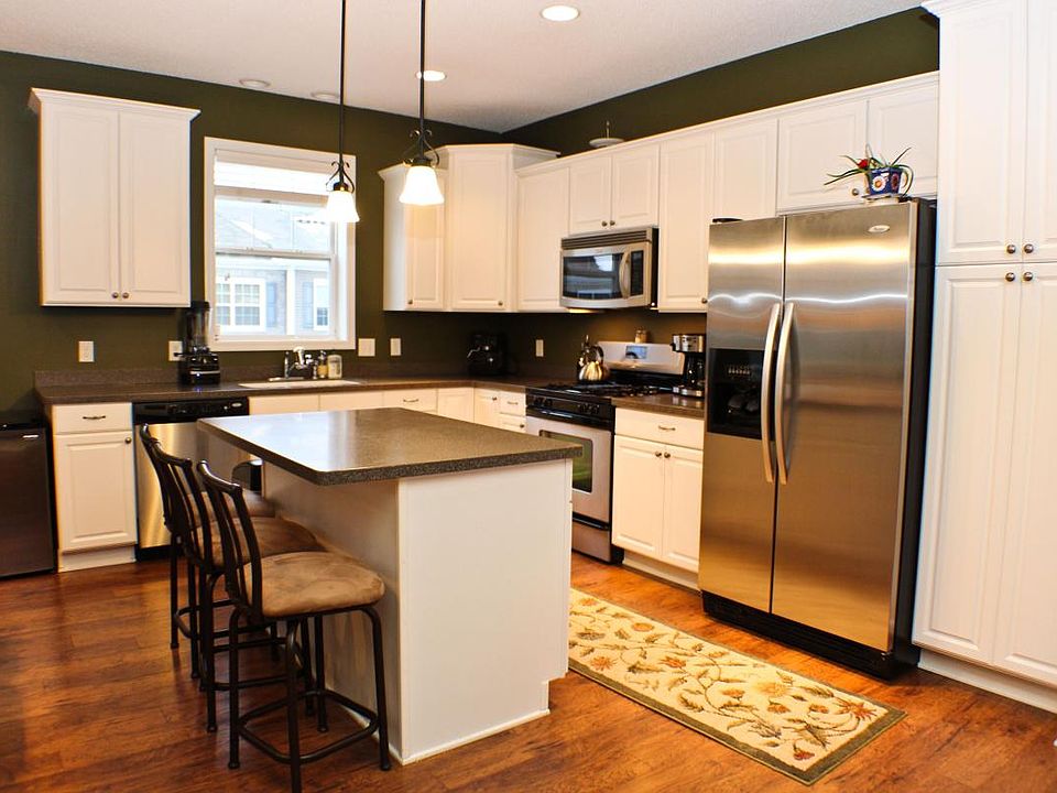 Kitchen with island - hardwood floors