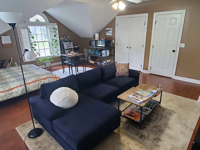 Studio space with Queen bed, couch, kitchenette, TV