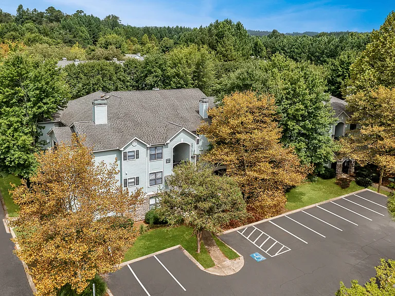 Aerial view of residential building and parking