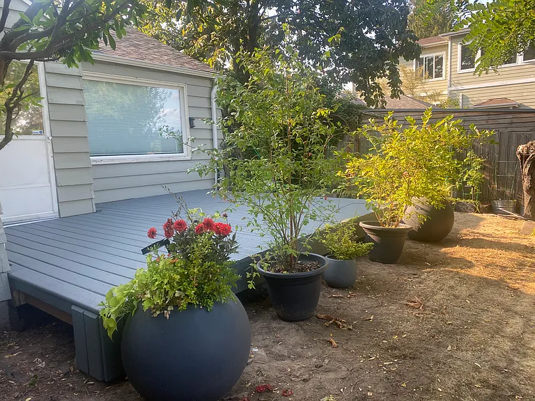 Private backyard with open deck and two tiered yard. 2 Planter boxes for your gardening pleasure!