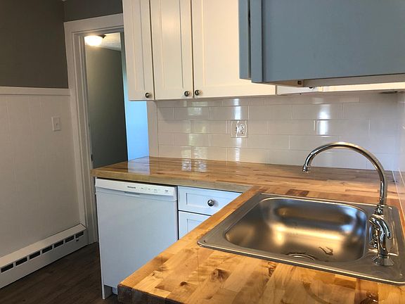 Beautiful, new kitchen! Back hall access to the left of the dishwasher.