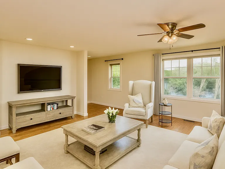 Oak wood floors, open layouts, and windows with curtain rods.