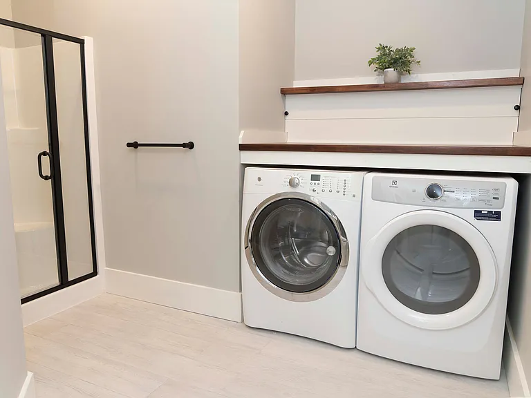 Shower and laundry area (located in the bathroom).