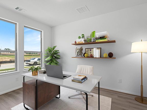 This versatile study with French doors offers a bright, peaceful retreat-ideal for a home office, cr