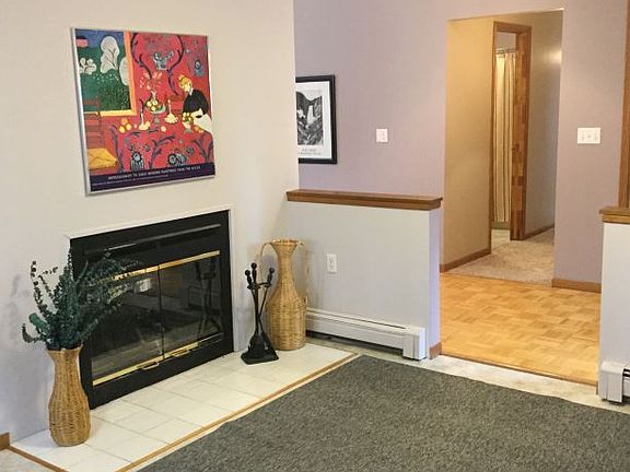 Wood-burning 2-way fireplace enhances your eating area just off the kitchen - could be a nice sittin