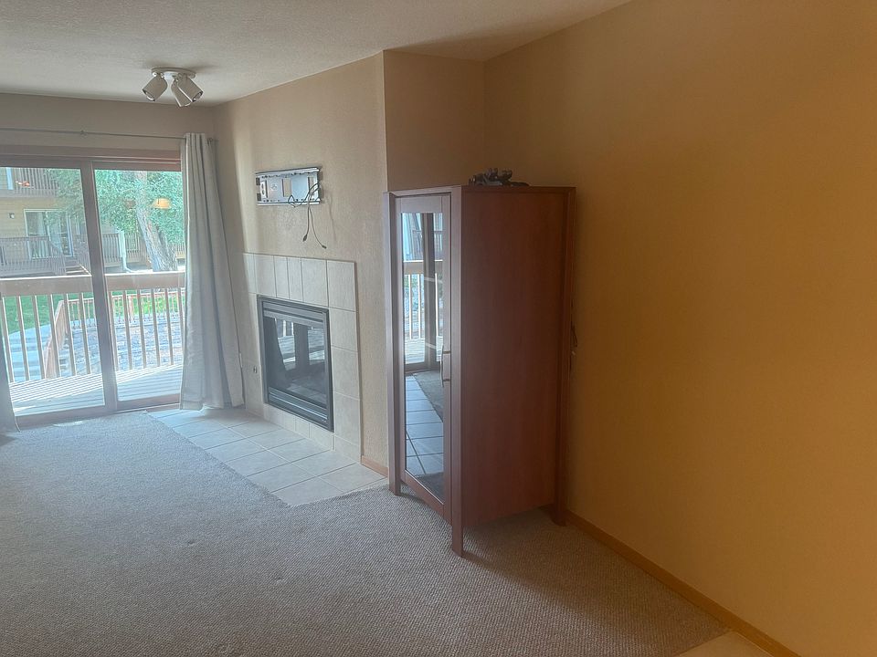 Main living space with gas fireplace and tv mount.