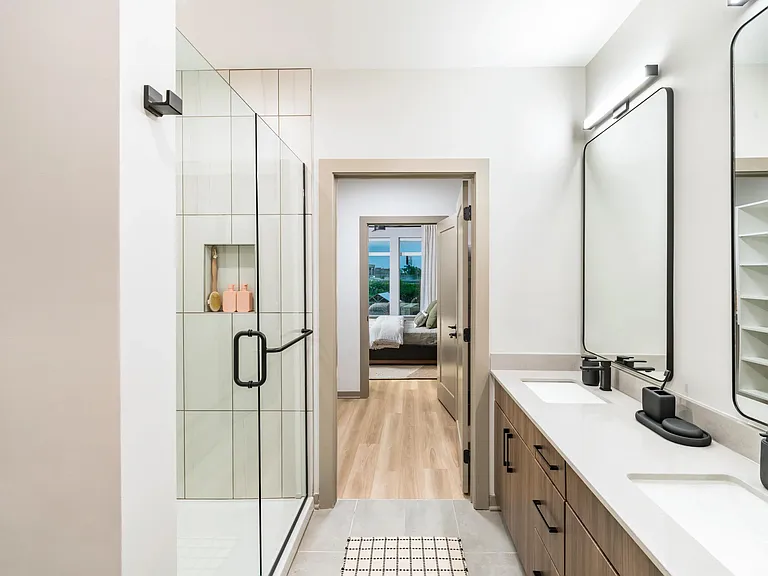 Dual vanity setup and spacious shower, all steps from the bedroom and closet for effortless flow.