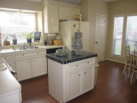 Island kitchen with breakfast room.  Also has the new laminate wood floors.