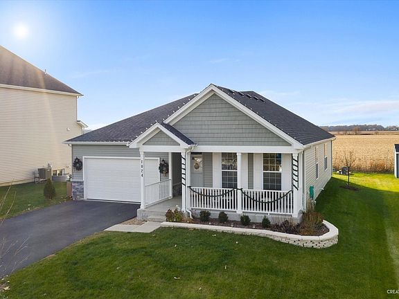 Professionally landscaped front exterior.