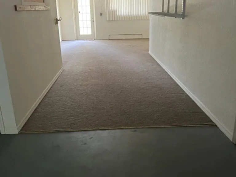 Rear half of garage area makes for a work room-play area, with walkin storage not shown in photo