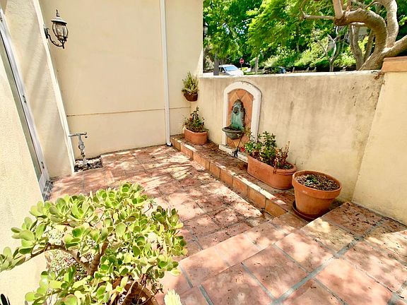 Front Patio that opens to Grand entry room with fountain