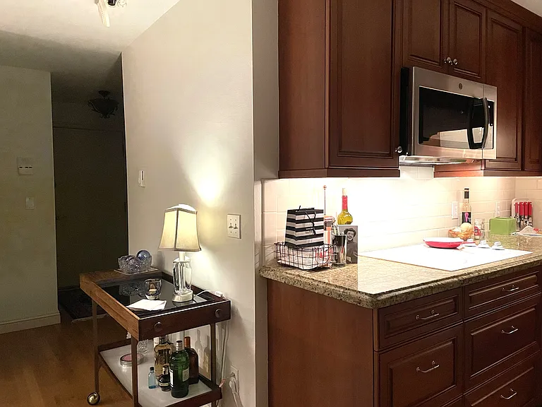 West wall of kitchen and bedroom and bath beyond.