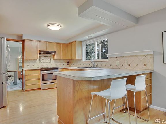 Open Kitchen with Included Stainless Steel Appliances