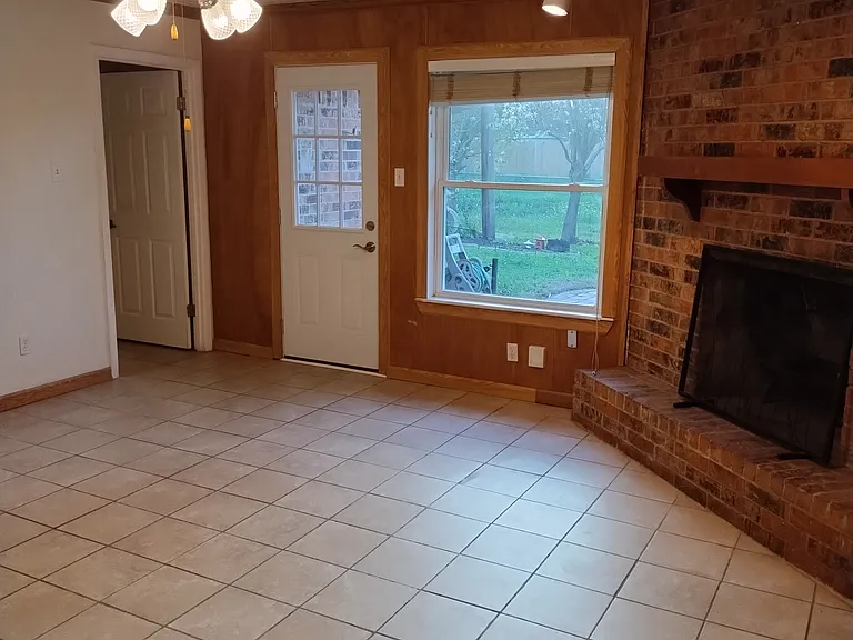 From Den looking towards Master, Back door, and Fire place.