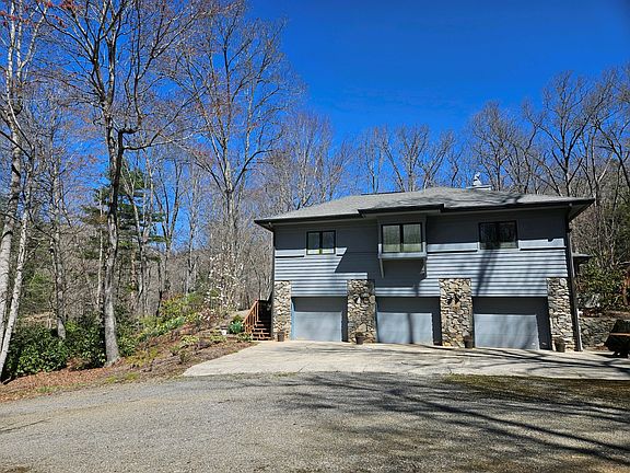 Right side of house with three-door garage