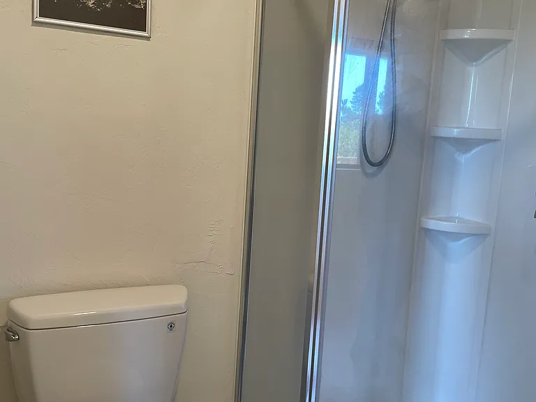 Bath has new overheard light and new fan.