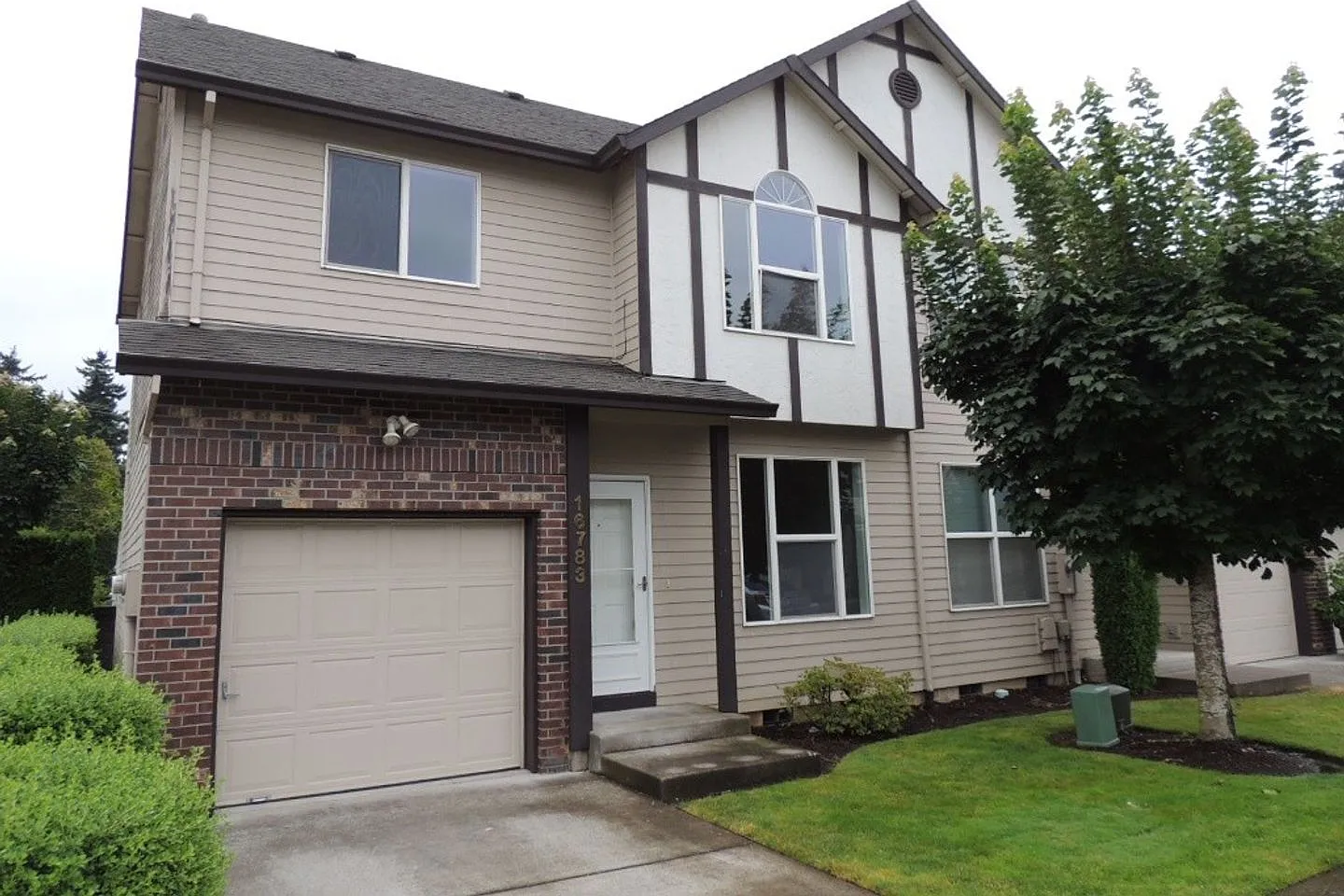 Move-In Special 1/2 Off First Month's Rent! Charming 3-Bedroom End-Unit Townhome With Attached Ga... — Photo 2
