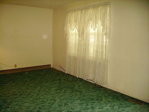 Living Room - This home has beautiful oak floors beneath all of the carpets.  