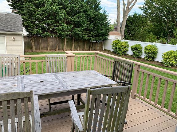 Rear deck to oversized private yard Garage on left not included.