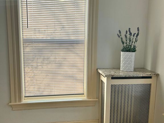 Living room: Radiator enclosure with granite top
