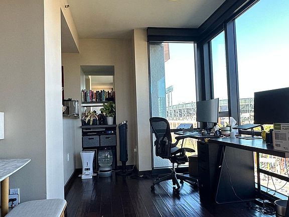 Living/dining area (currently set up with two work stations)