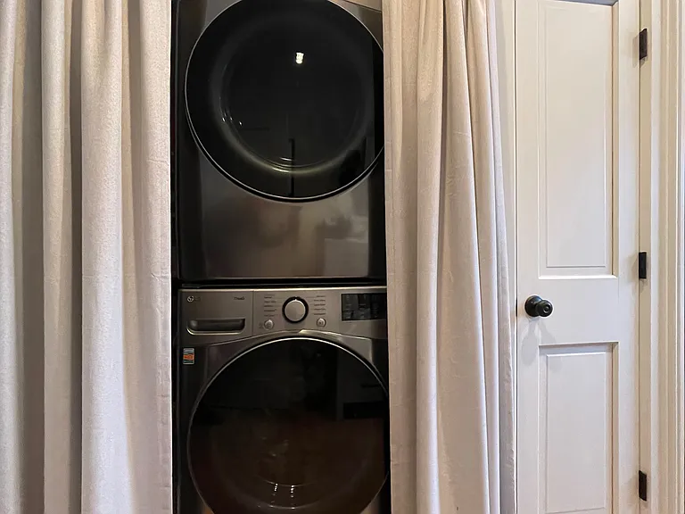 Stackable washer/dryer in primary bathroom