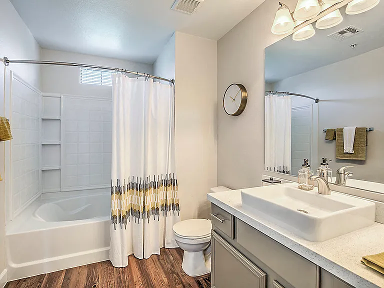 Indulge in luxury at The Michael B: where every detail, from the sleek fixtures to the spa-like bathtub, transforms your daily routine into a tranquil escape.