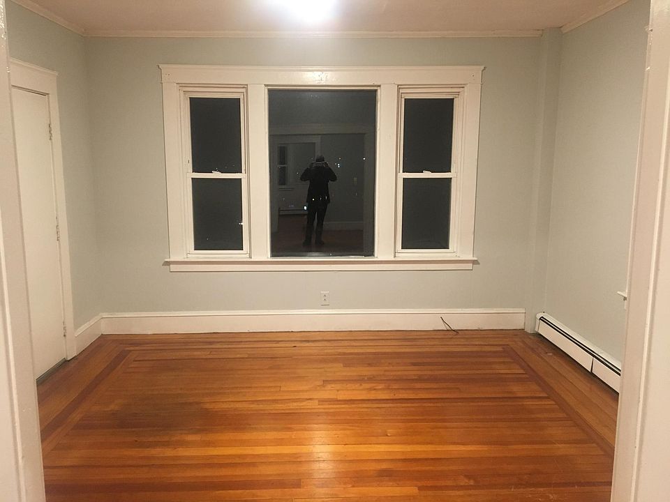 Living room with lots of windows and natural lighting