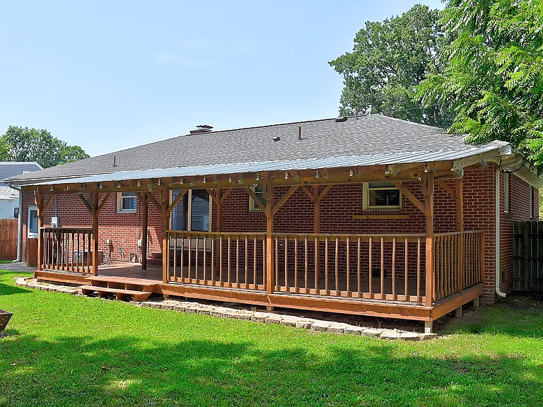 Huge covered back deck for multi season relaxing.