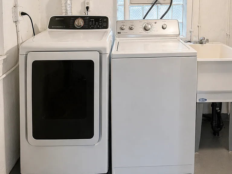 Washer and Dryer, located in basement area.