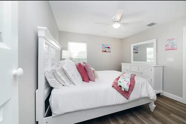 Stylish third bedroom with queen bed with fun decor.