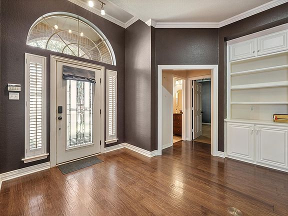 **Recently repainted in lighter color scheme** Front entry, towards second bedroom