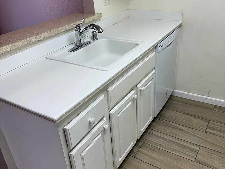 Sink cabinetry. wall beyond is not pink!