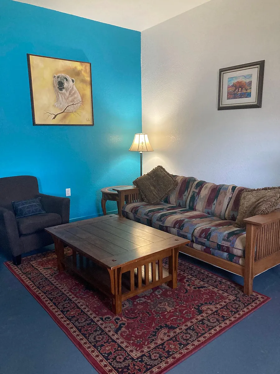The cozy living room is to right as you walk through the door - please see next photo for the correct photo of the sofa - this photo was taken after the sofas changed - 1539 SE Mill St