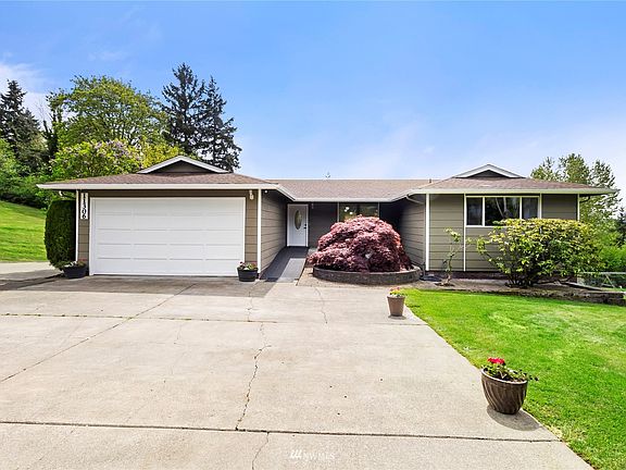 1 story with basement in beautiful park like setting.