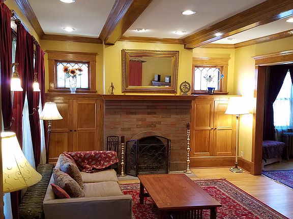 Formal Living Room with Box Beam Ceilings and Natural Woodwo