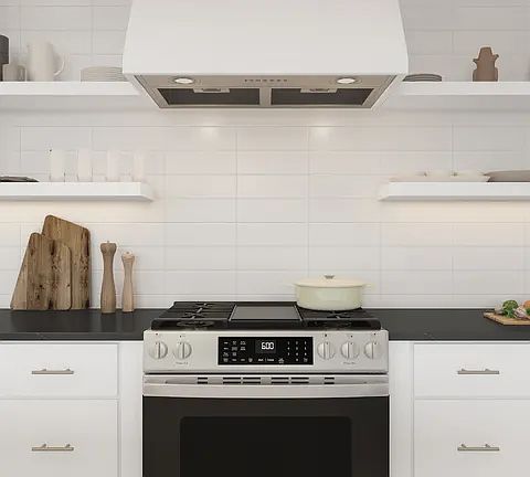 Kitchen with waterfall island, pendant lighting and volume ceiling
