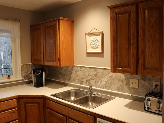 One angle of the kitchen. With sink and dishwasher.