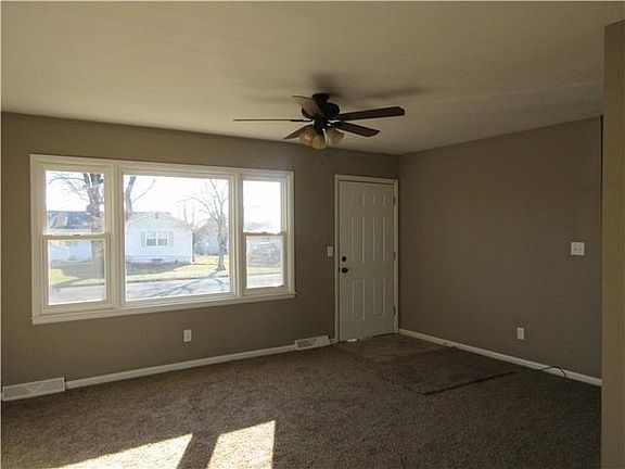 LIVING ROOM - NEW CARPET - FAN- DOOR- WINDOWS