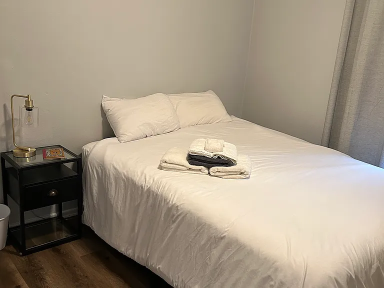 BACK BEDROOM IS FURNISHED WITH A QUEEN SIZE BED, ETC.