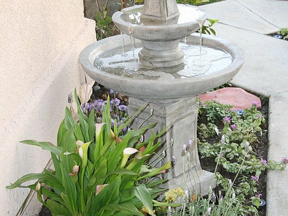 Tiled entry with soothing fountain