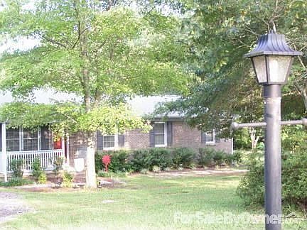 Front of home in summer.