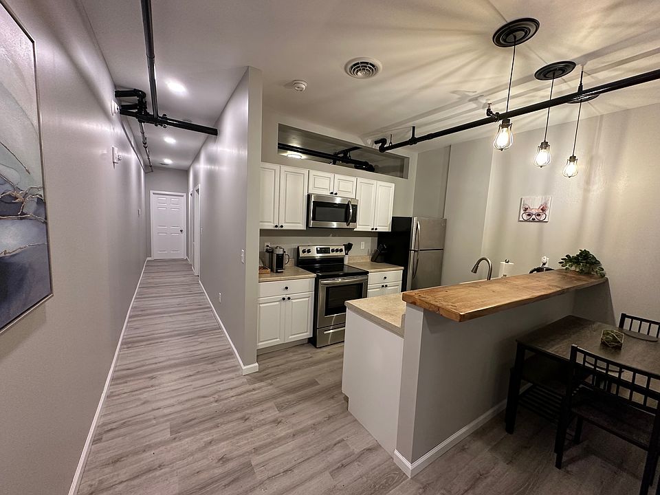 Kitchen with built-in microwave, dishwasher, and a Nespresso Vertuo