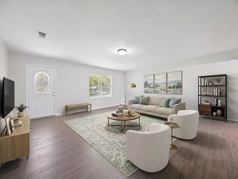 Huge living space where everyone can hang out and that huge sectional or the couch AND the comfy chairs fit! Virtually staged.