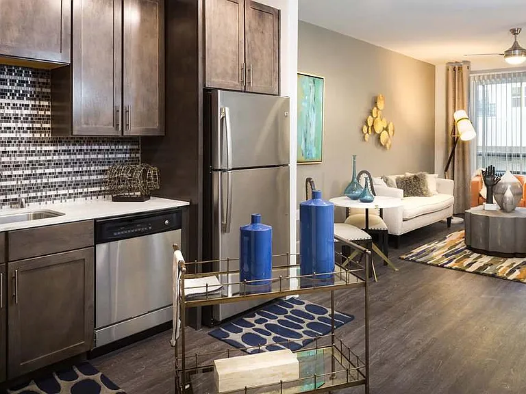 Modern Kitchen with Stainless Steel Appliances, Custom Cabinets, and Tiled Backsplash
