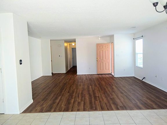 Living room and hallway to bedrooms, shows front door open