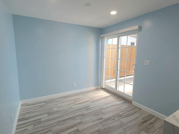 Living room with sliding door that opens to your own private patio.