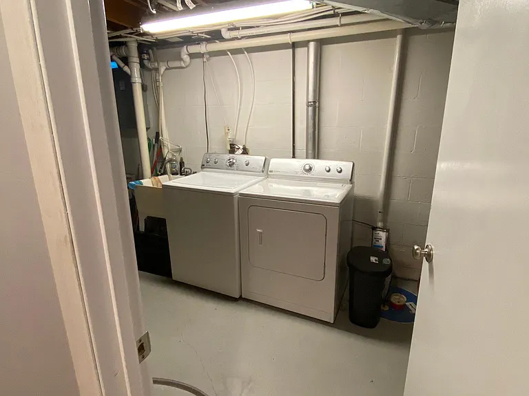 Downstairs laundry room with tons of storage space