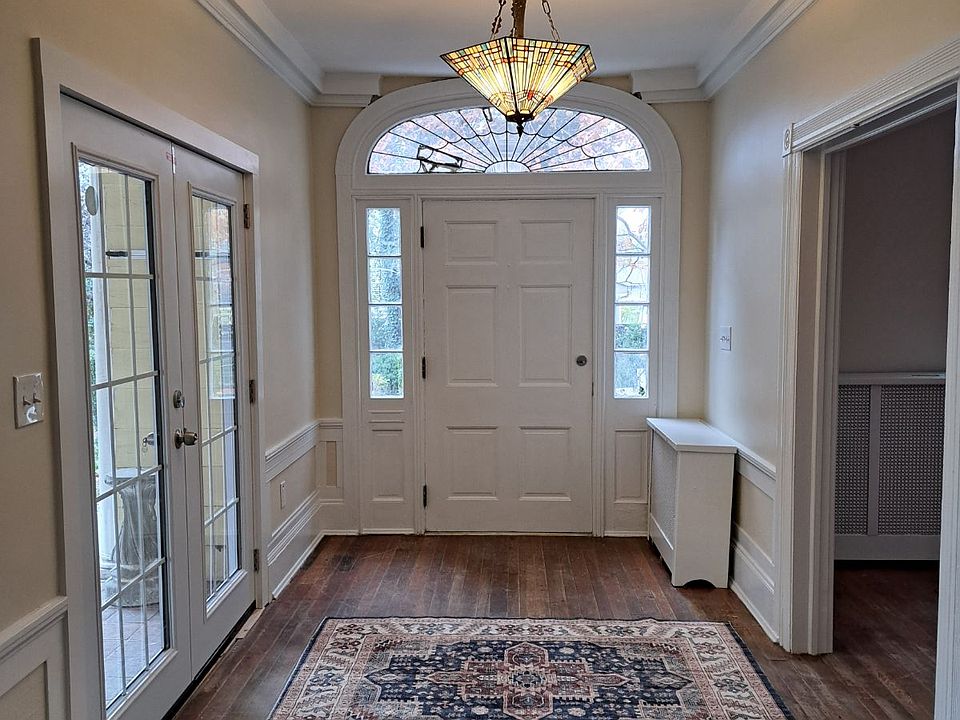 Foyer with main door, patio door and entry to living room.