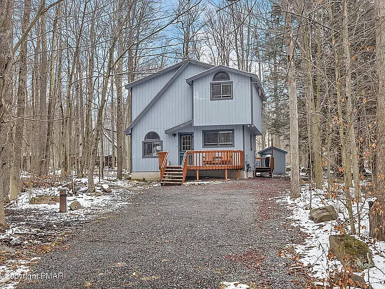 Front Exterior & Parking _ Welcoming curb appeal with ample off-street parking, providing plenty of space for multiple vehicles and convenient access to the home.